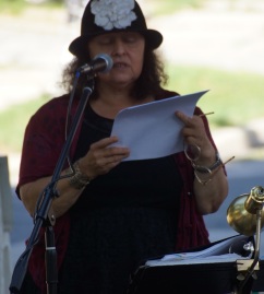 Poet Christina Zadowski reads poetry. Photo © by Lee Matz.