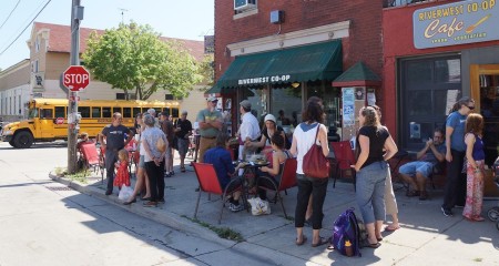 Noon gathering outside of Riverwest Co-op and Café. Photo © by Lee Matz.